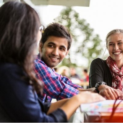 Group of students talking at UQ.